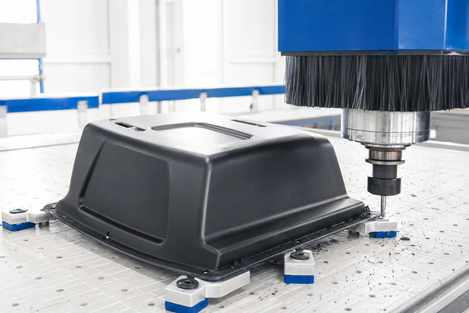 Finishing a thermoformed plastic part after forming.